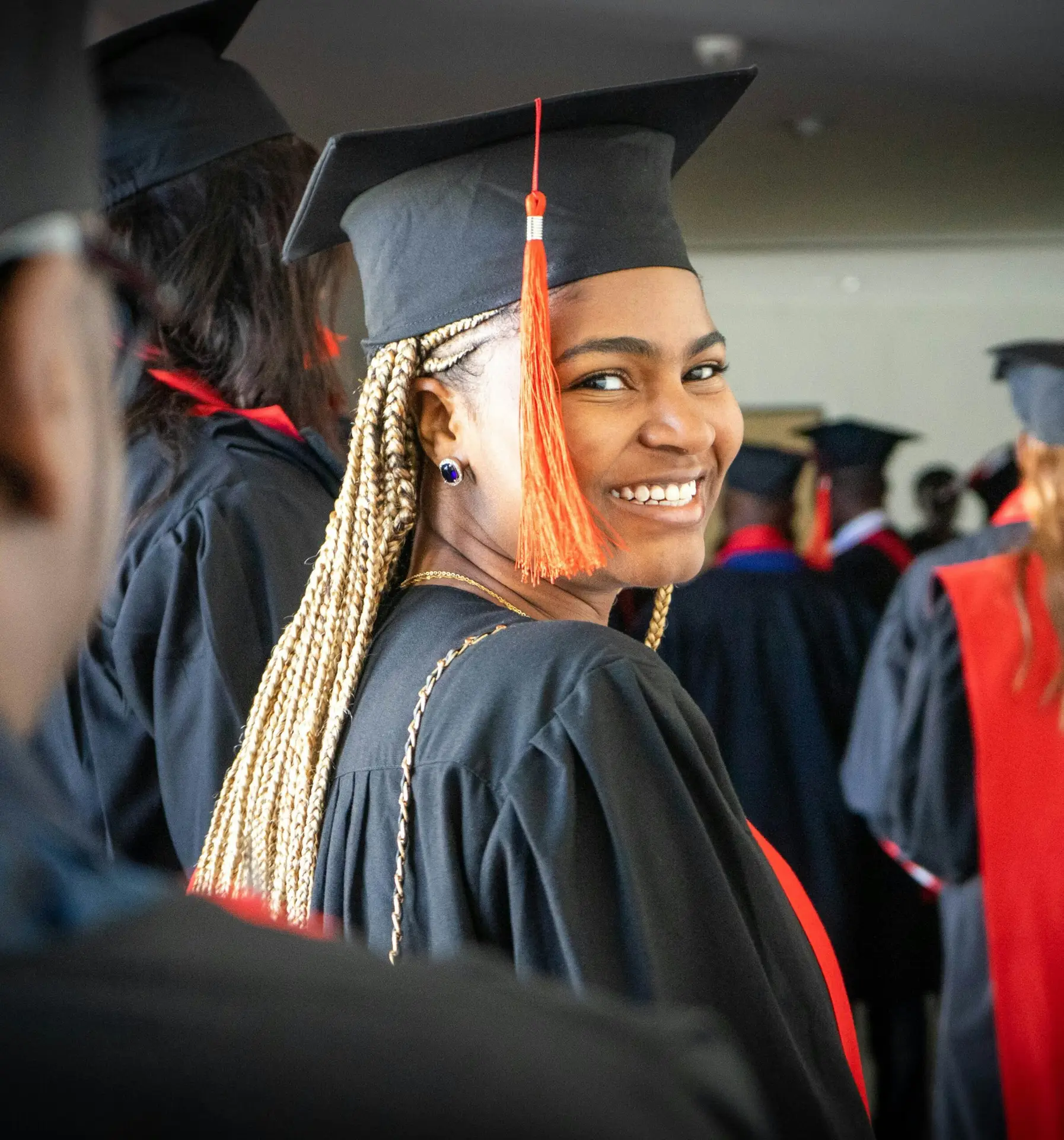 A young Black woman graduates from college